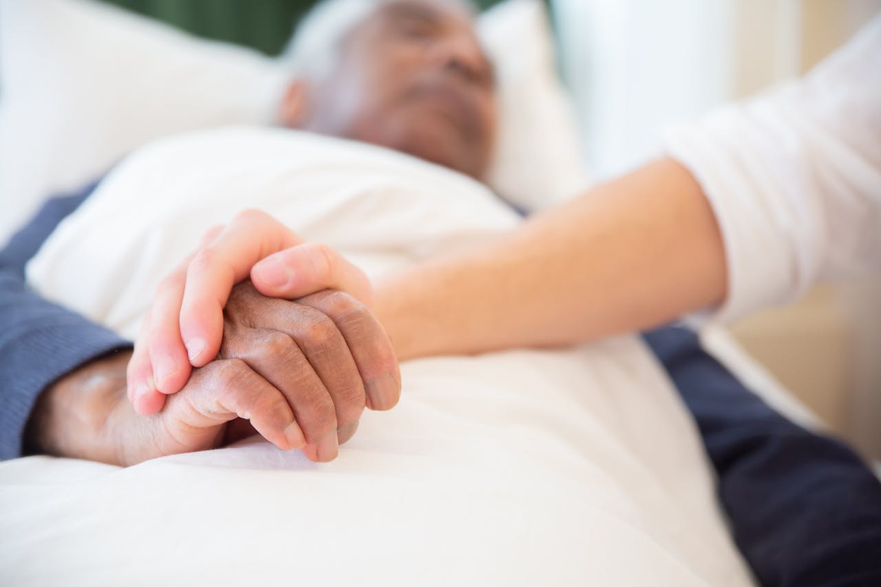 Physician providing emotional and psychological support to a dementia patient as part of palliative care